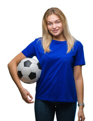 Young caucasian woman holding soccer ball over isolated background with a happy face standing and smiling with a confident smile showing teeth