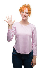 Young redhead woman showing and pointing up with fingers number five while smiling confident and happy.