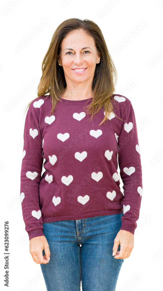 Sticker beautiful middle age woman wearing hearts sweater over isolated background with a happy and cool smi