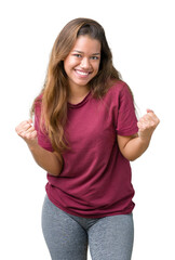 Fototapeta na wymiar Young beautiful brunette woman over isolated background very happy and excited doing winner gesture with arms raised, smiling and screaming for success. Celebration concept.