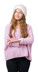 Young beautiful brunette woman wearing sweater and winter hat over isolated background smiling looking side and staring away thinking.