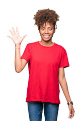 Fototapeta na wymiar Beautiful young african american woman over isolated background showing and pointing up with fingers number five while smiling confident and happy.