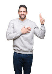 Young handsome man wearing sweatshirt over isolated background Swearing with hand on chest and...
