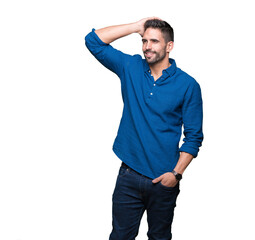 Young handsome man over isolated background Smiling confident touching hair with hand up gesture,...