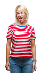 Fototapeta premium Young beautiful blonde woman over isolated background sticking tongue out happy with funny expression. Emotion concept.