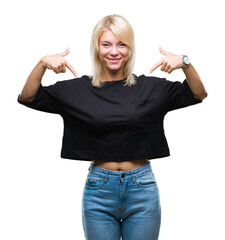 Young beautiful blonde woman over isolated background looking confident with smile on face, pointing oneself with fingers proud and happy.