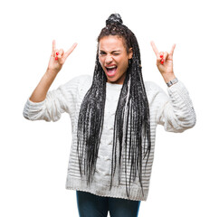 Young braided hair african american girl wearing sweater over isolated background shouting with crazy expression doing rock symbol with hands up. Music star. Heavy concept.