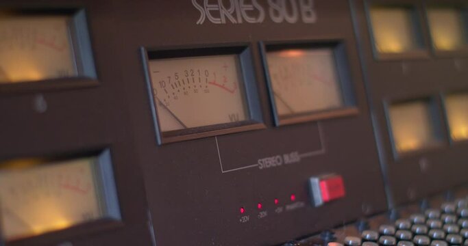 Close-up of audio mixing console, VU meter