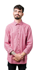 Young handsome man wearing pink shirt over isolated background smiling looking side and staring away thinking.