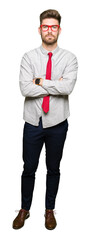 Young handsome business man wearing glasses skeptic and nervous, disapproving expression on face...
