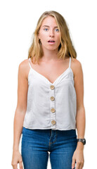 Obraz premium Beautiful young woman over isolated background afraid and shocked with surprise expression, fear and excited face.
