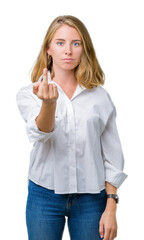 Beautiful young business woman over isolated background Showing middle finger, impolite and rude fuck off expression
