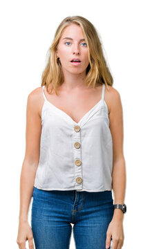 Beautiful young woman over isolated background afraid and shocked with surprise expression, fear and excited face.