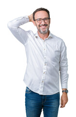 Fototapeta premium Handsome middle age elegant senior business man wearing glasses over isolated background Smiling confident touching hair with hand up gesture, posing attractive