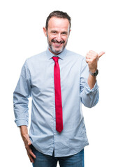 Middle age hoary senior business man wearing red tie over isolated background smiling with happy face looking and pointing to the side with thumb up.