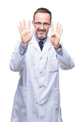 Middle age senior hoary professional man wearing white coat over isolated background showing and pointing up with fingers number nine while smiling confident and happy.