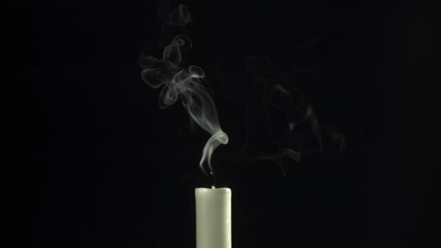 Extinguished candle with smoke. Filmed is slow motion 1000 fps. High quality FullHD footage