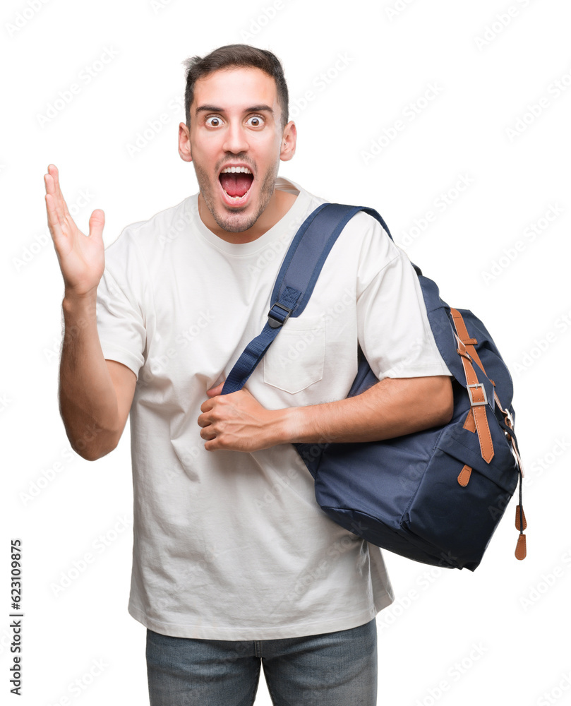 Poster Handsome young man holding backpack very happy and excited, winner expression celebrating victory screaming with big smile and raised hands