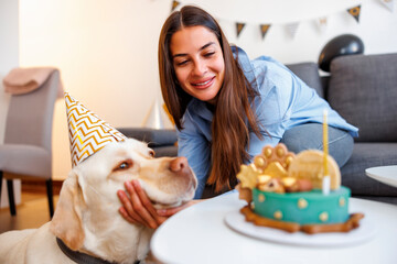 Dog having a birthday party with his owner