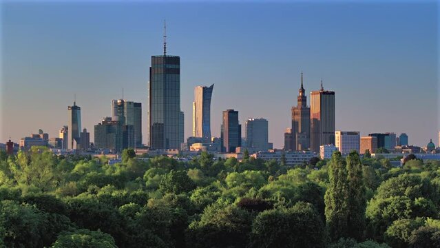 Aerial, drone panorama of Warsaw city during sunset. View from Pole Mokotowskie Park 
