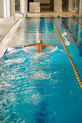 Man exercising for health in the pool