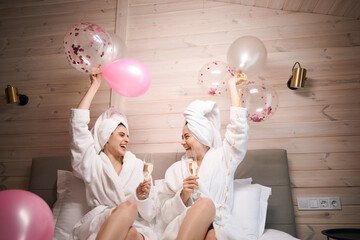 Smiling females having fun at bachelorette party after spa