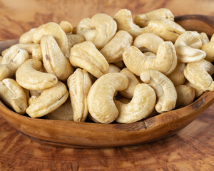 Nuts. Cashews on a plate. Healthy nuts. healthy food. post. cashews on a plate on a wooden table
