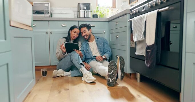 New home, renovation and couple with digital tablet on a kitchen floor for idea, search or inspiration. Real estate, property and man with woman online for creative, planning and interior design