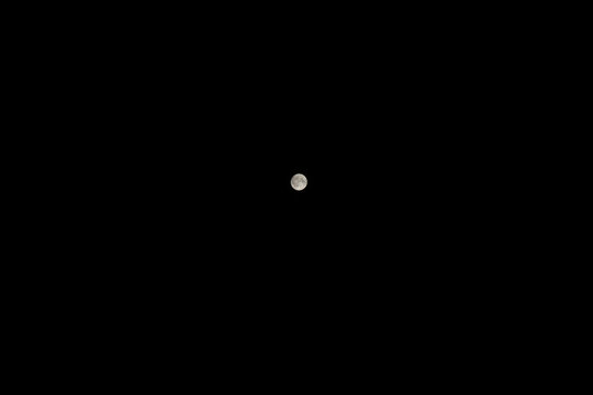 Full moon in the middle of the dark night in minimalist style