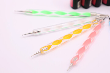 Materials and tools for nail care on white background