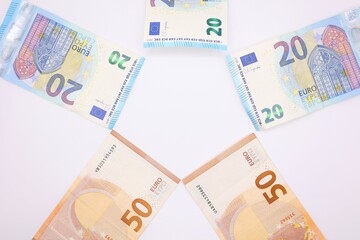 Representation of the economy in banknotes of different denominations in euros with a white background