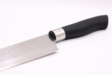 Knife a kitchen tool with a black handle on a white background