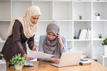 Professional Muslim business team working together, discussing on an important project in the office room.