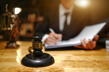  lawyers or attorneys discussing a contract agreement. Successful businessmen have a contract in place to protect it,signing of modest agreements form in office...