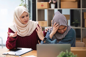 Muslim woman freelancer sme business online online start up business team having an argument about the plan.