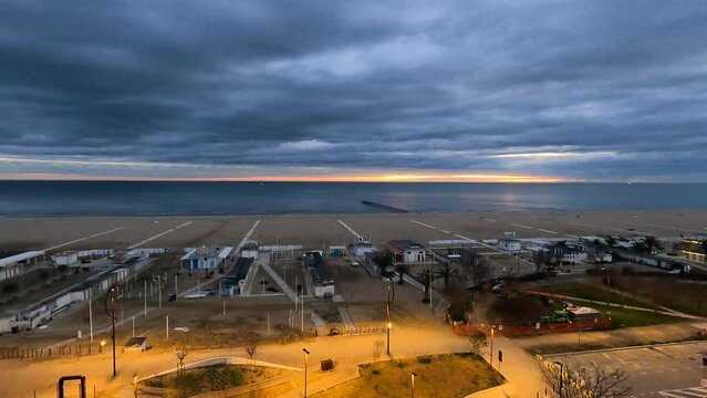 Winter sunrise at Rimini beach, Italy, timelapse