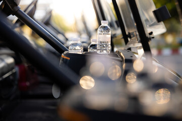 Water bottle in golf carts for golf player on golf course. golf course carts cars at luxury golf...