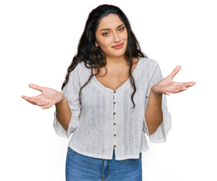 Brunette young woman wearing casual clothes clueless and confused expression with arms and hands raised. doubt concept.