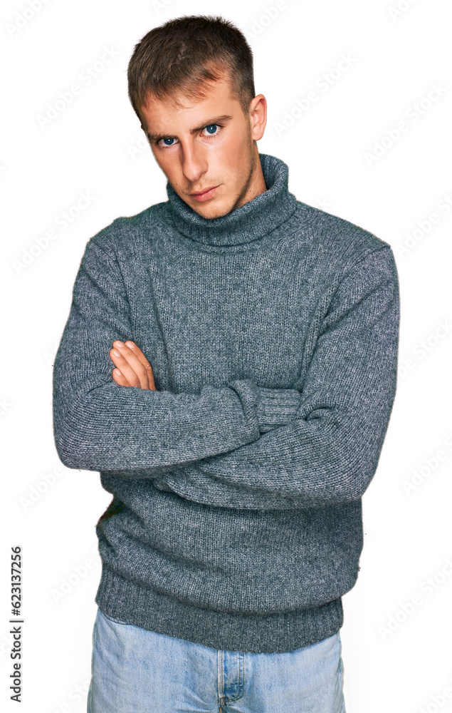 Poster Young blond man wearing casual clothes skeptic and nervous, disapproving expression on face with crossed arms. negative person.