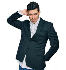 Handsome hispanic man wearing business clothes suffering of neck ache injury, touching neck with hand, muscular pain