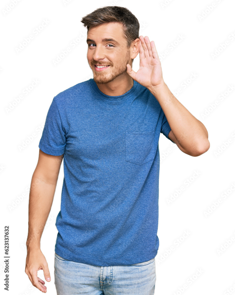 Wall mural handsome caucasian man wearing casual clothes smiling with hand over ear listening an hearing to rum