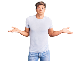 Young handsome man wearing casual clothes clueless and confused expression with arms and hands raised. doubt concept.