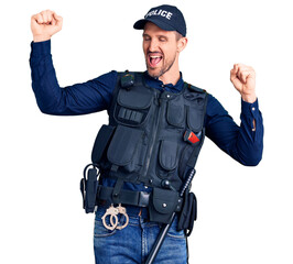 Young handsome man wearing police uniform dancing happy and cheerful, smiling moving casual and confident listening to music