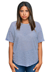 Fototapeta premium Young latin girl wearing casual clothes depressed and worry for distress, crying angry and afraid. sad expression.