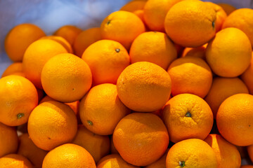 Tangerines on a market counter