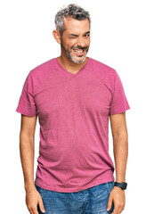 Obraz premium Middle age grey-haired man wearing casual clothes winking looking at the camera with sexy expression, cheerful and happy face.