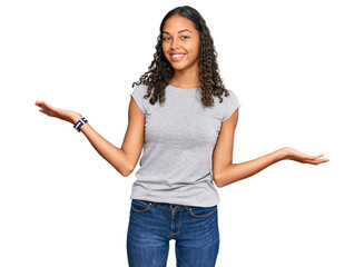 Young african american girl wearing casual clothes smiling showing both hands open palms, presenting and advertising comparison and balance