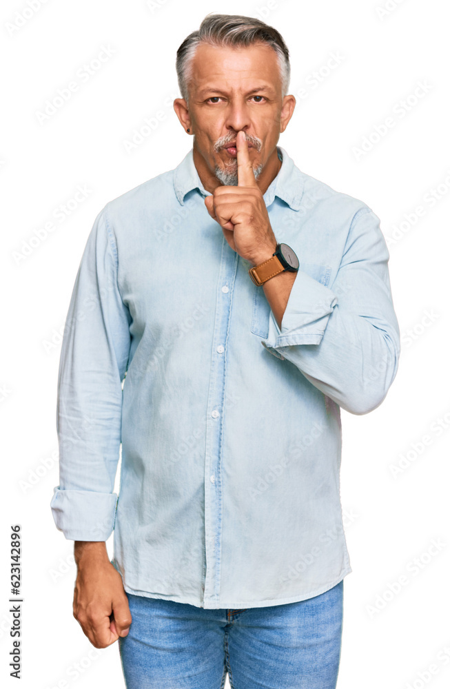 Sticker middle age grey-haired man wearing casual clothes asking to be quiet with finger on lips. silence an