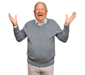 Senior caucasian man wearing casual clothes celebrating victory with happy smile and winner expression with raised hands