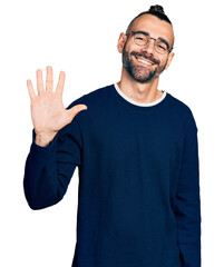 Hispanic man with ponytail wearing casual sweater and glasses showing and pointing up with fingers number five while smiling confident and happy.